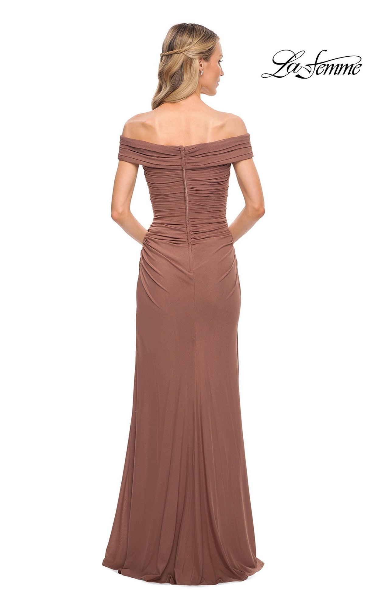 Back view of a woman in Long Formal Dress: La Femme 29541, featuring a ruched fitted bodice and off-the-shoulder neckline against a white background.